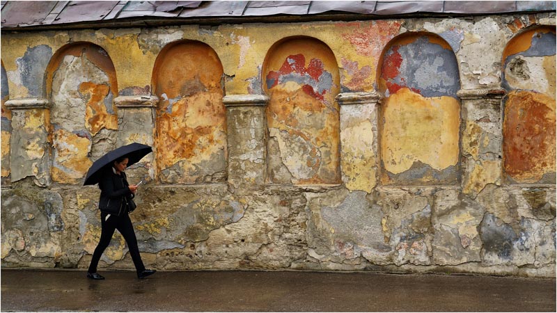 With a black ombrella