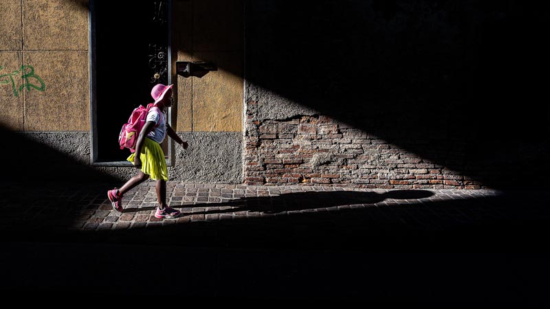 the child with the pink hat